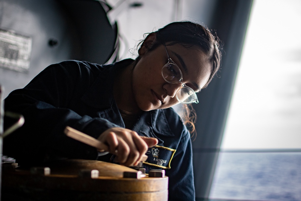 Sailor Maintains Deck Equipment