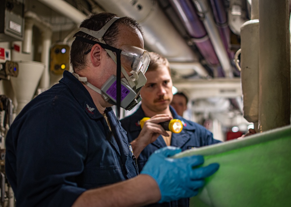 Sailor Performs Maintenance On Fan Coil Unit