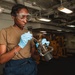 U.S. Sailor Performs Maintenance on Fire Hose