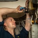 Sailor Performs Maintenance On Connector Box