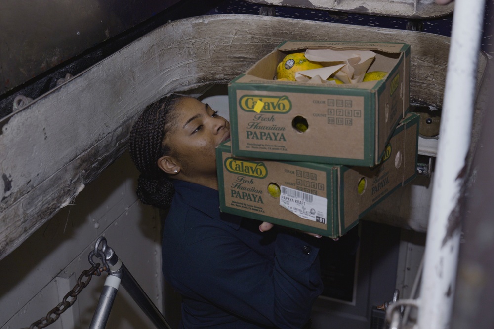 USS Carl Vinson (CVN 70) Sailor Moves Supplies