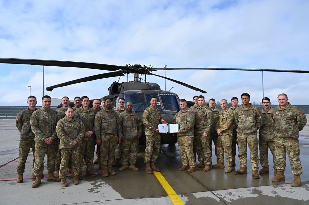 Crew Chief, Spc. Thai Davis, displays West Point acceptance note