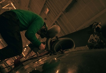 Helicopter Maritime Strike Squadron (HSM) 78 Sailor Conducts Aircraft Maintenance