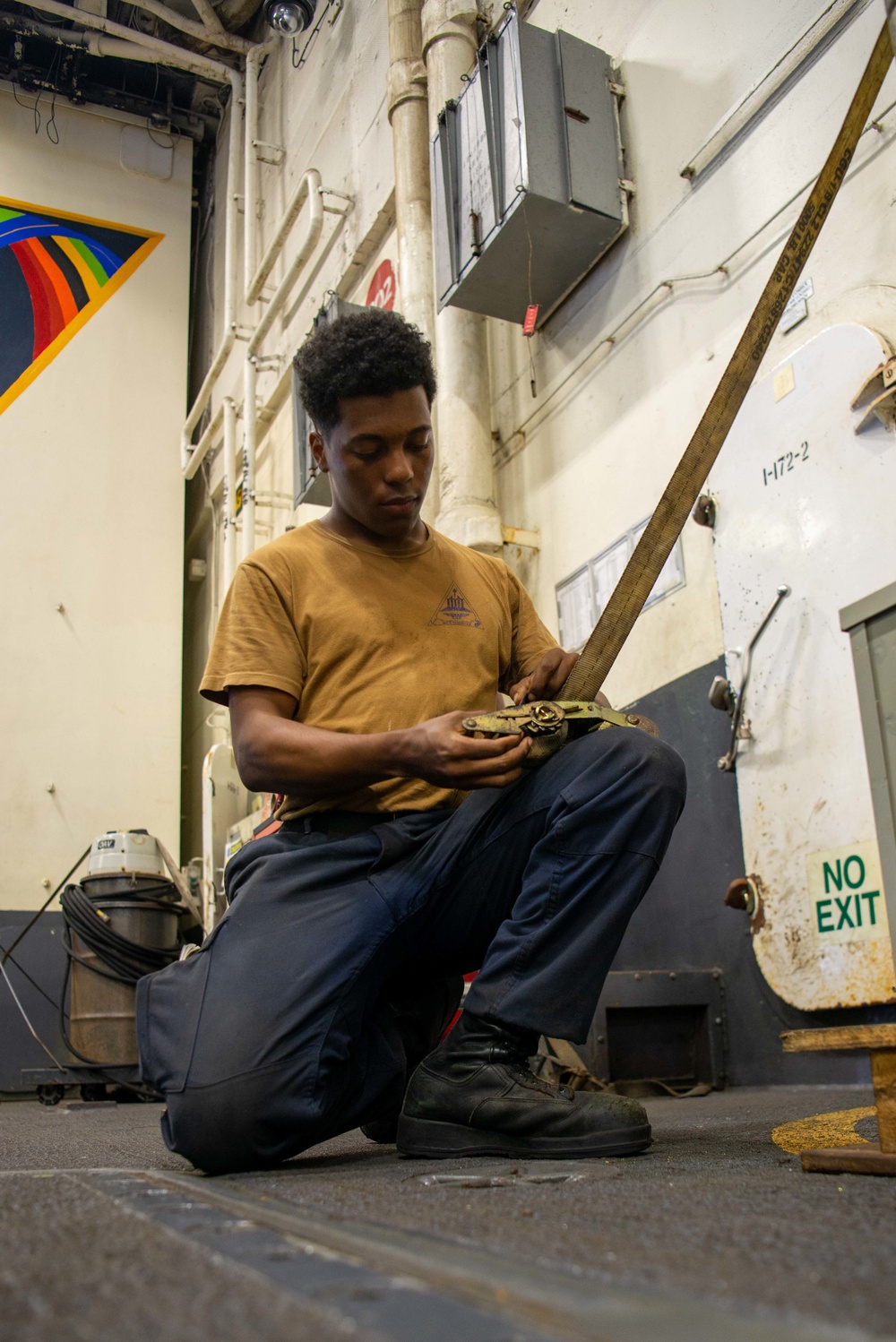 U.S. Navy Sailor Fixes Ratchet Strap