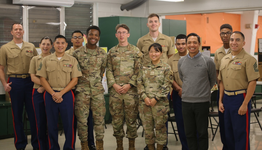 Marines Volunteer to score Science Fair Projects at Maria A. Ulloa Elementary School