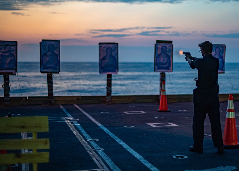 Sailor Fires An M9 Service Pistol