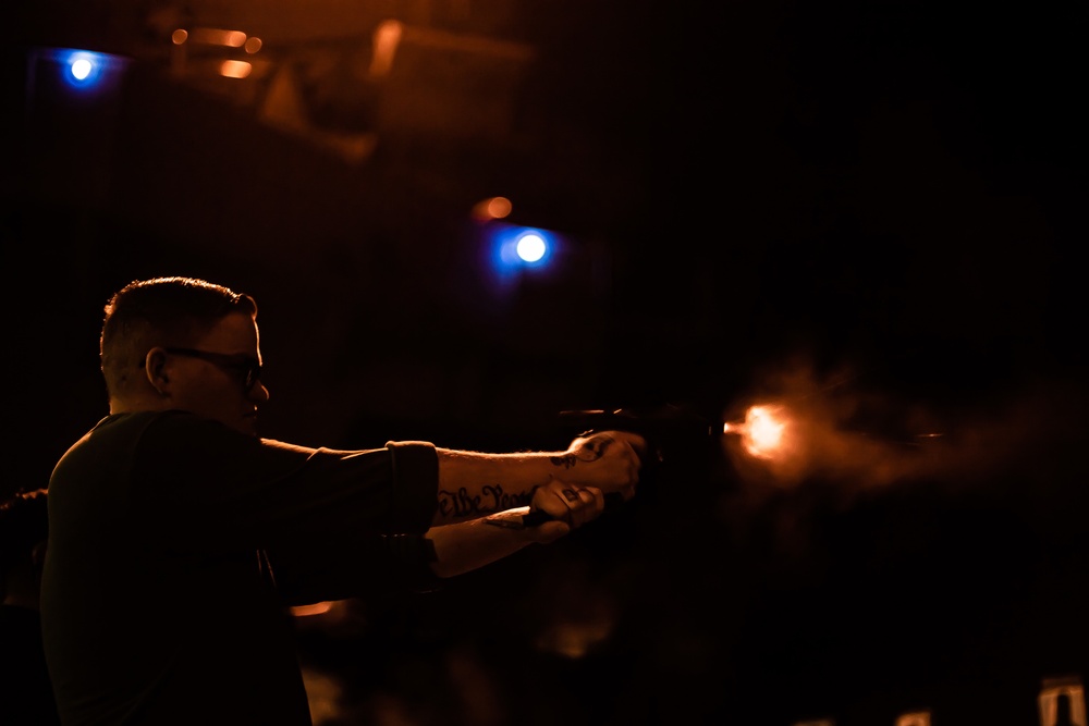 Sailor Fires An M9 Service Pistol