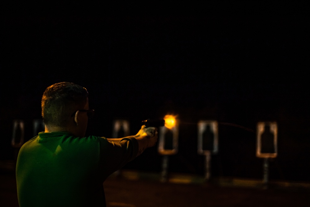 Sailor Fires An M9 Service Pistol