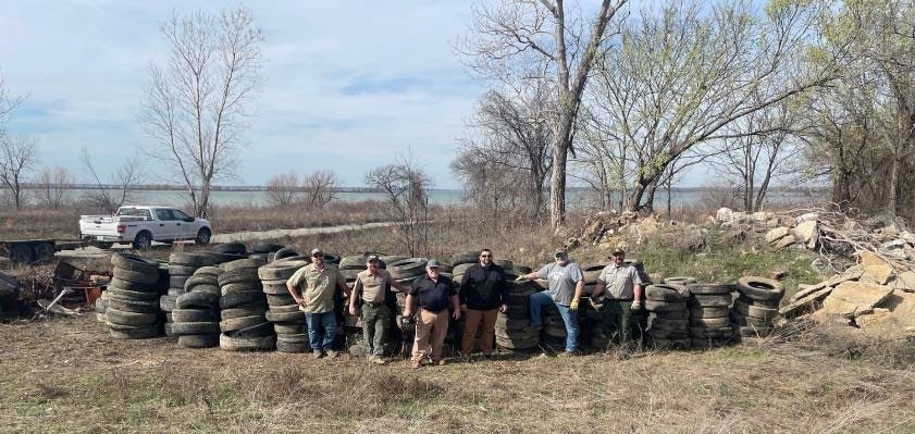 Red River Area USACE staff remove illegally dumped tires