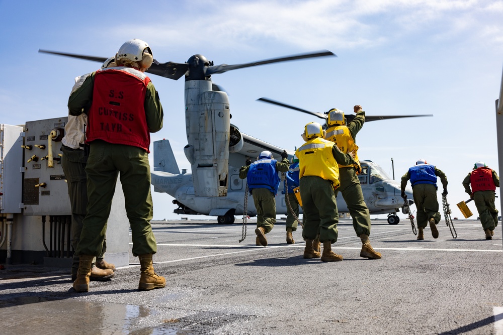 VMM-163 conducts deck landing qualifications aboard the SS Curtiss