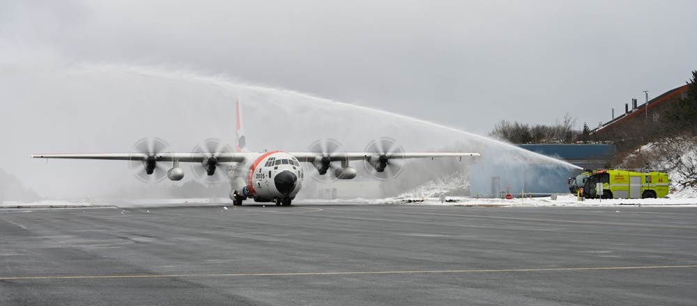 Coast Guard Air Station Kodiak C-130 Hercules airplane receives water salute