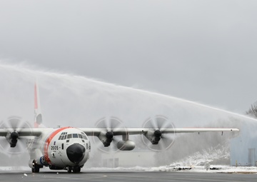 Coast Guard Air Station Kodiak C-130 Hercules airplane receives water salute
