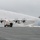 Coast Guard Air Station Kodiak C-130 Hercules airplane receives water salute