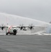 Coast Guard Air Station Kodiak C-130 Hercules airplane receives water salute