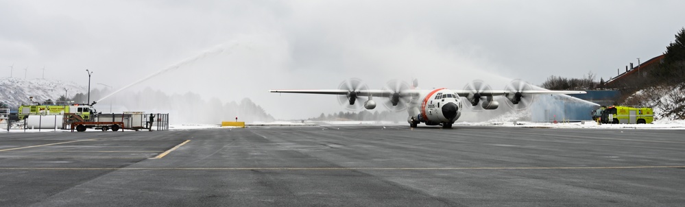 Coast Guard Air Station Kodiak C-130 Hercules airplane receives water salute