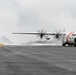 Coast Guard Air Station Kodiak C-130 Hercules airplane receives water salute