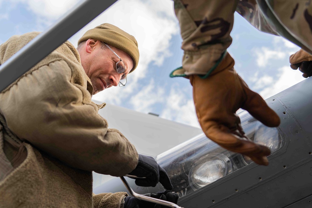 Airmen from the 914th ARW Aircraft Maintenance Squadron working on KC-135's wing lights