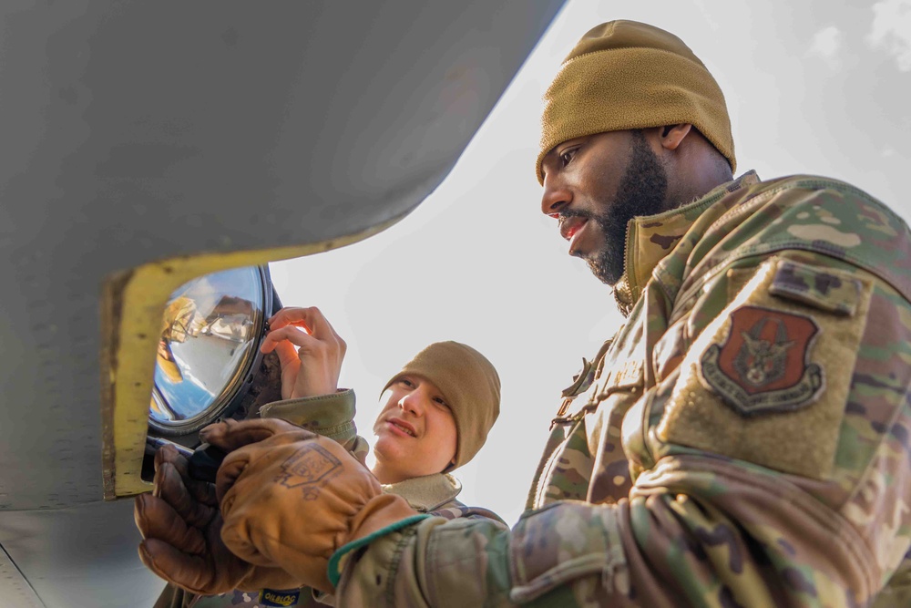 Airmen from the 914th ARW Aircraft Maintenance Squadron working on KC-135's wing lights