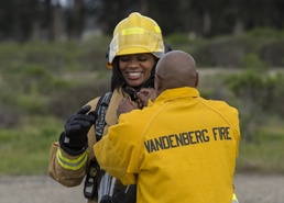 Base commander and command chief join fire team for exercise