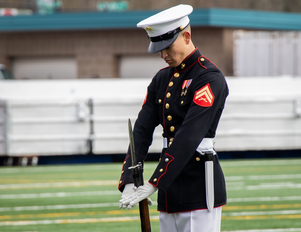 Marines of the Battle Color Detachment, Marine Barracks Washington, perform for students at Chief Sealth International High School, Seattle Washington.