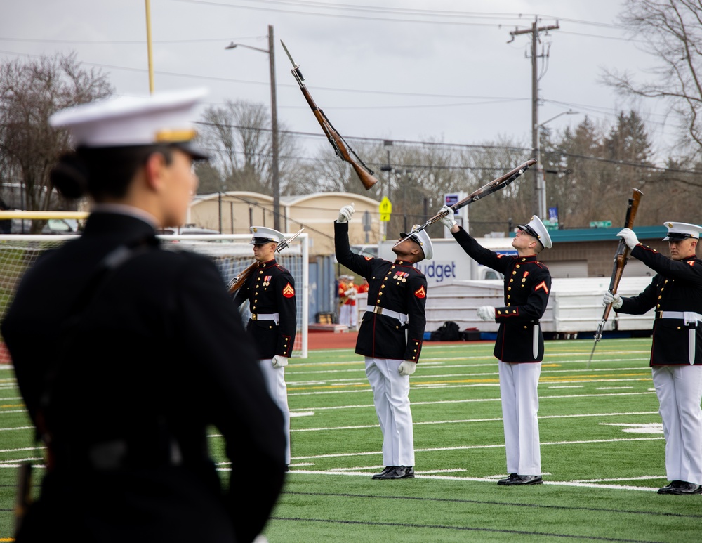 Marines of the Battle Color Detachment, Marine Barracks Washington, perform for students at Chief Sealth International High School, Seattle Washington.