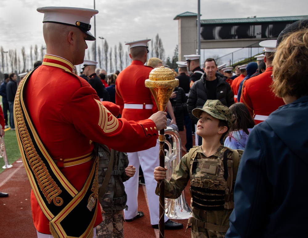 Marines of the Battle Color Detachment, Marine Barracks Washington, perform for students at Chief Sealth International High School, Seattle Washington.