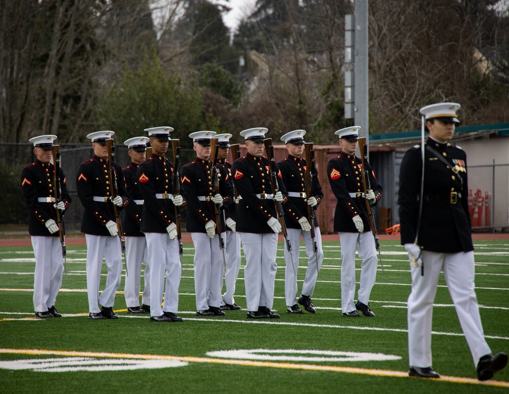 Marines of the Battle Color Detachment, Marine Barracks Washington, perform for students at Chief Sealth International High School, Seattle Washington.