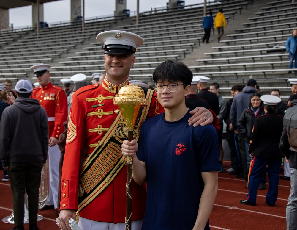 Marines of the Battle Color Detachment, Marine Barracks Washington, perform for students at Chief Sealth International High School, Seattle Washington.