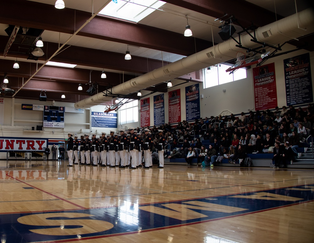 Marines of the Silent Drill Platoon, Marine Barracks Washington, performed for students at Silas High School in Tacoma, Washington.