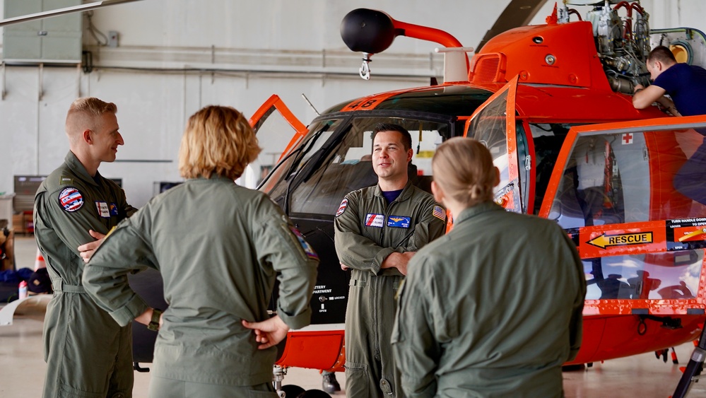 U.S. Coast Guard aircrew conducts engagement with U.S. Navy helicopter crew