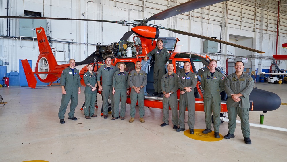 U.S. Coast Guard aircrew conducts engagement with U.S. Navy helicopter crew