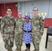 28th Infantry Division Soldiers posing with a Women's Army Corps veteran at the Women's History Month celebration