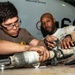 Sailors Disassemble Aircraft Landing Gear Activate