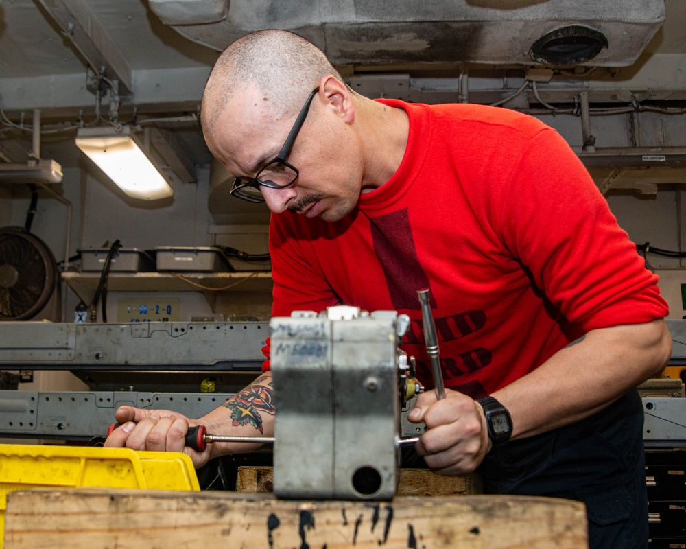 Sailor Disassembles Bomb Rack