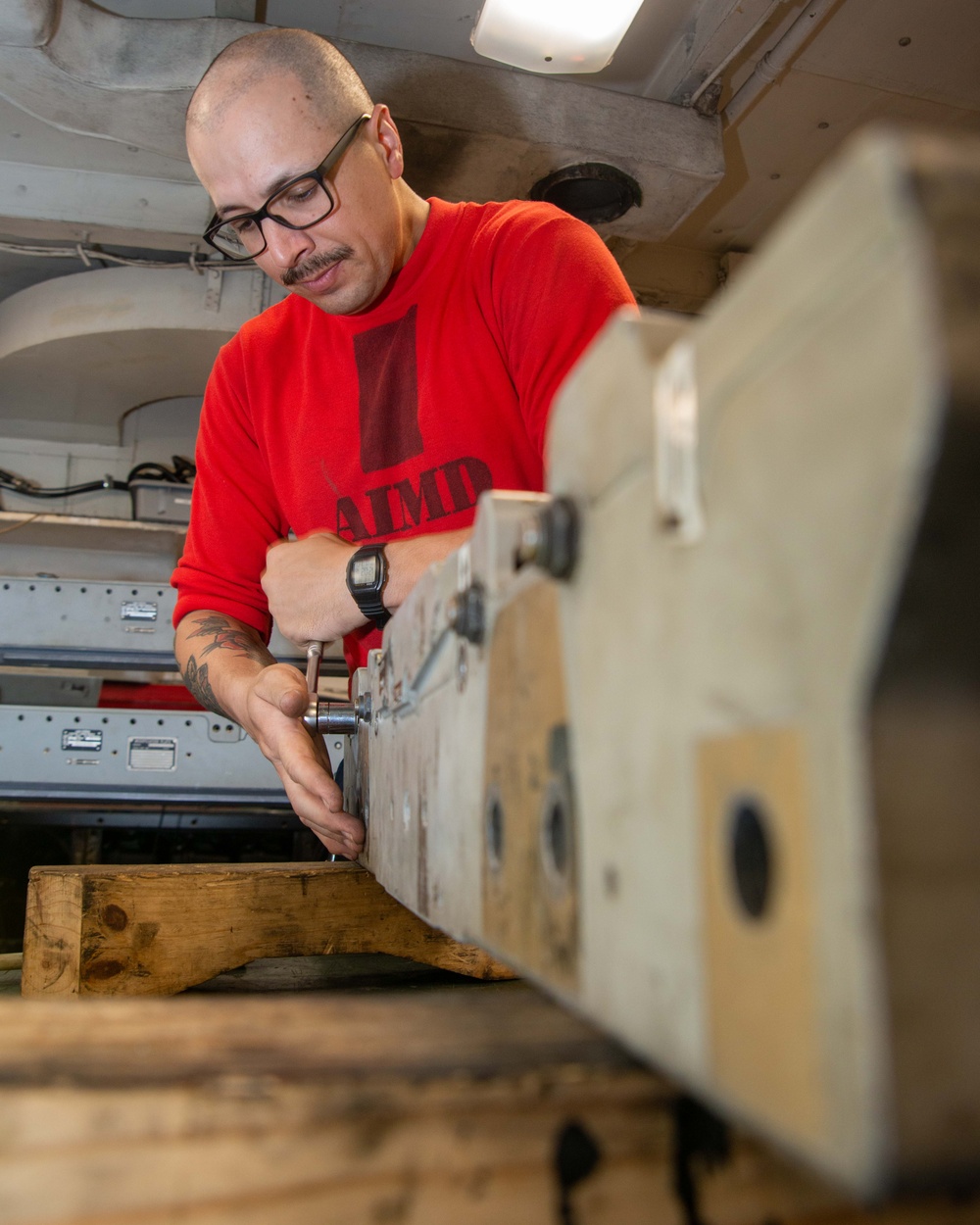 Sailor Disassembles Bomb Rack