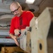 Sailor Disassembles Bomb Rack