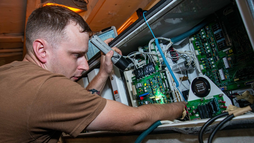 Sailor Removes Power Supply Circuit Board from an SFC Unit