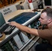 Sailor Removes Power Supply Circuit Board from an SFC Unit