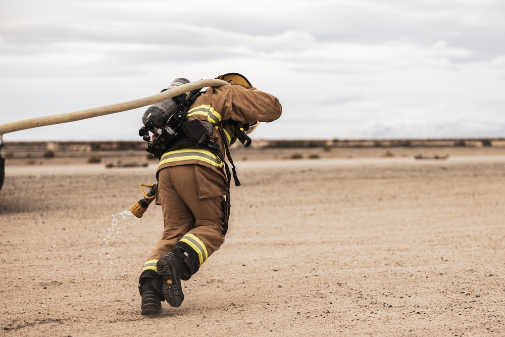 Aircraft rescue, firefighting Marines team up with MCAGCC Fire Department during a mass casualty drill