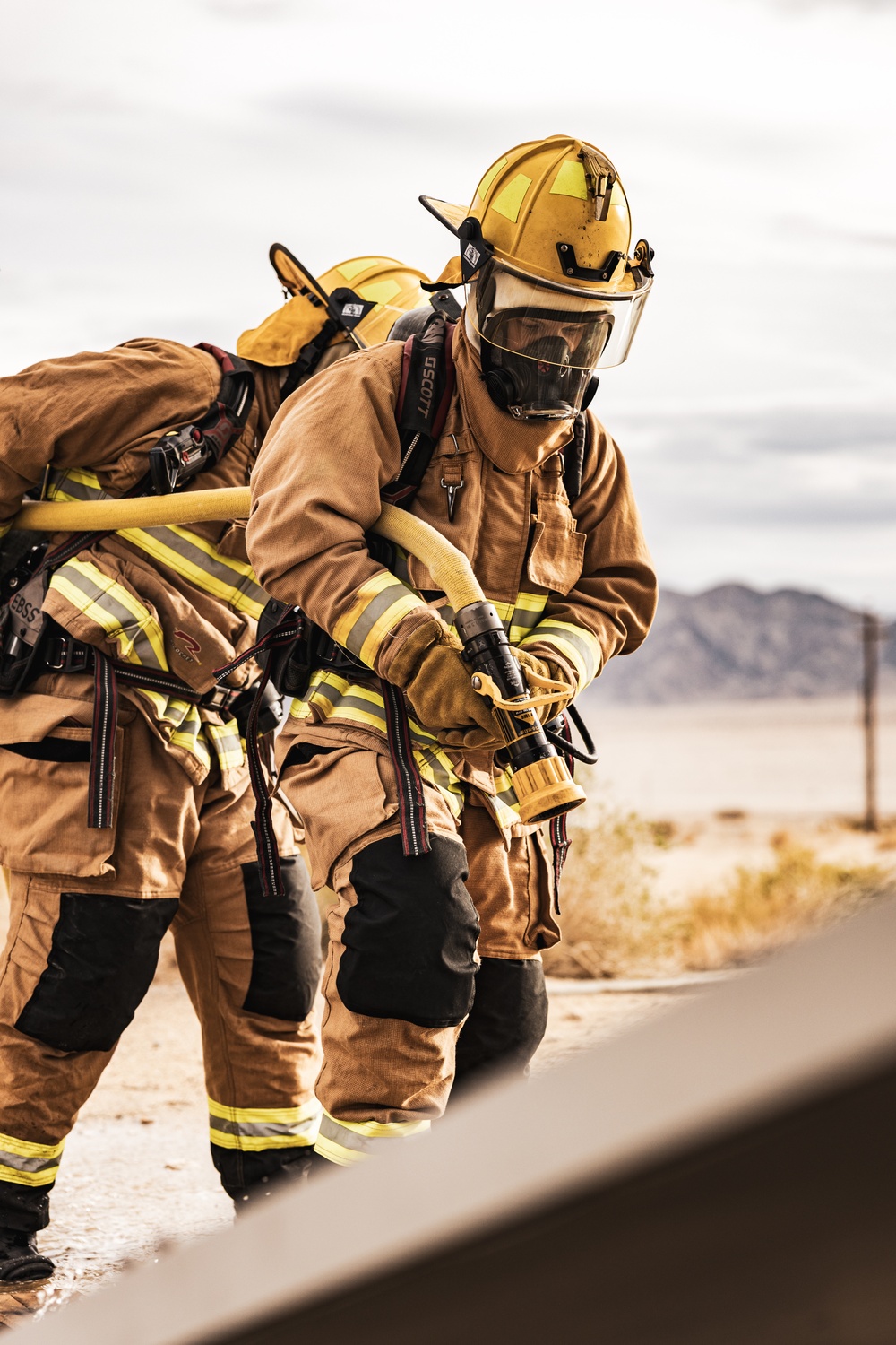 Aircraft rescue, firefighting Marines team up with MCAGCC Fire Department during a mass casualty drill