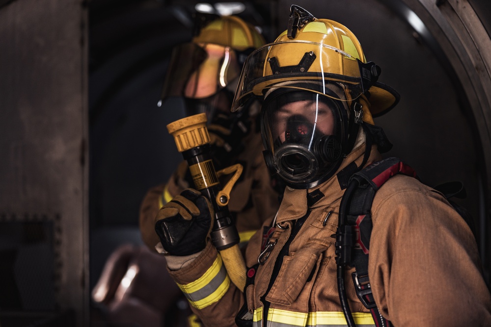 Aircraft rescue, firefighting Marines team up with MCAGCC Fire Department during a mass casualty drill