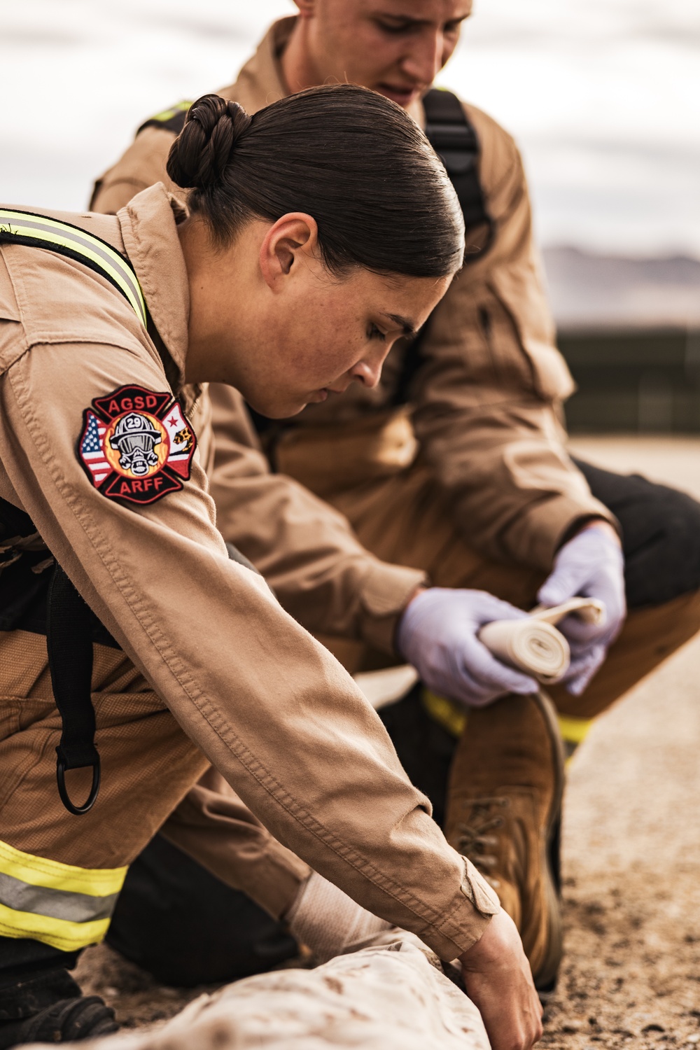 Aircraft rescue, firefighting Marines team up with MCAGCC Fire Department during a mass casualty drill