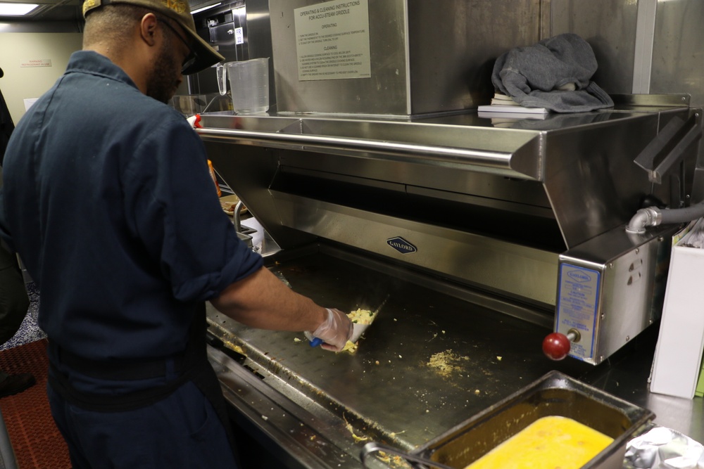 USS Kansas City (LCS 22) Sailor Prepares Breakfast