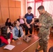 Soldier explains MREs to Bulgarian students