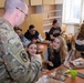 Soldier explains MREs to Bulgarian Students