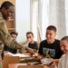 A Soldier interacts with Bulgarian Students