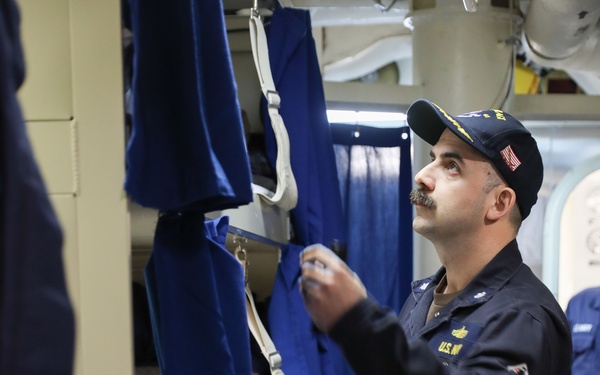 USS Ramage (DDG 61) performs a berthing inspection
