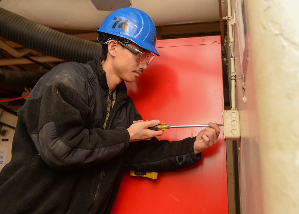 Sailor performs safety check