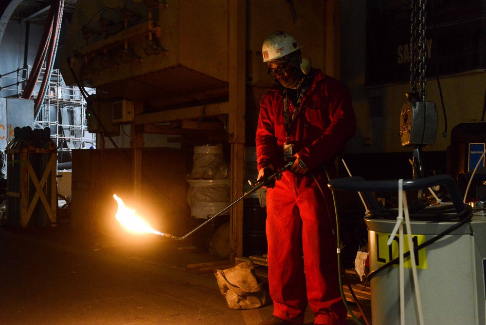 Contractor welds aboard the USS John C. Stennis