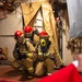 Sailors simulate fighting a fire